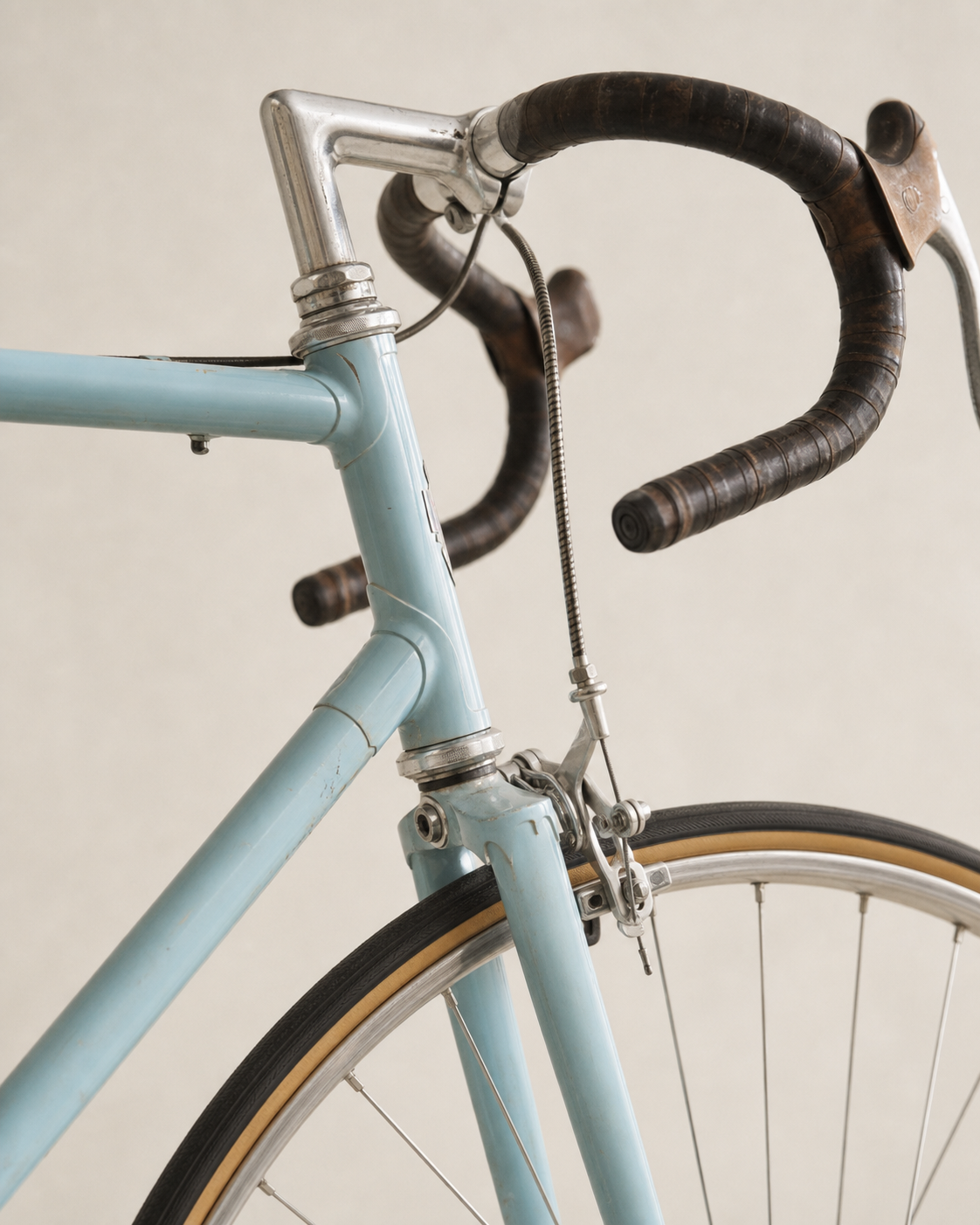 Close view of the Bianchi Folgore showing its head tube, lugged joints, fork crown, stem and handlebar